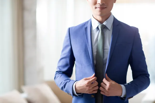 young-businessman-getting-dressed-in-the-morning-2024-10-17-05-21-37-utc-6810950cacd5a